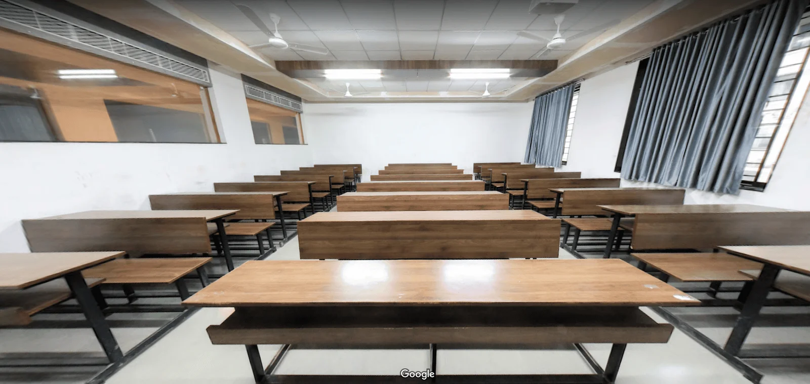 Modern multimedia classroom at GMIU with projector and digital screen